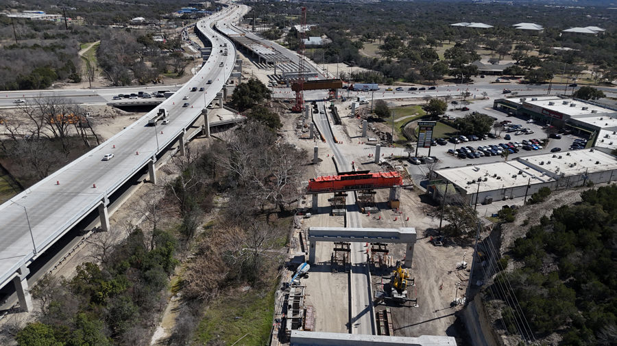 Oak Hill Parkway crews continue bridge construction for the future eastbound US 290 mainlanes. They begin with construction of support structures including columns and caps, then place beams, and finally complete the bridge deck by setting panels and pouring concrete. 