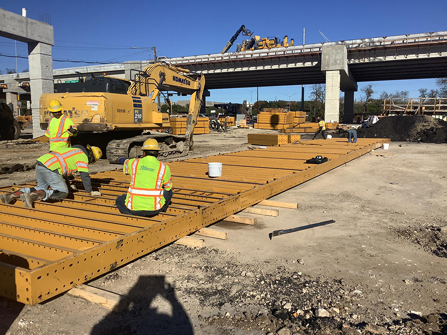 Structures crews assemble forms that will be used to mold straddle bent caps just east of William Cannon Drive. December 2024