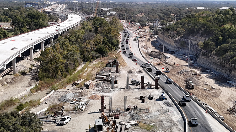 Crews build columns between SH 71 and William Cannon Drive that will support the future eastbound US 290 mainlanes in this area. October 2024.