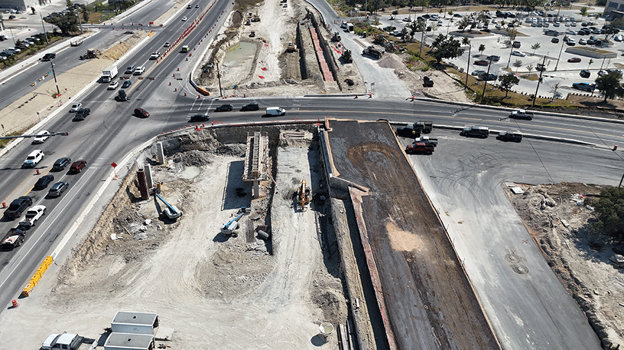 Crews begin building the columns and cap for the east side of the future RM 1826 cross-street bridge. October 2024.