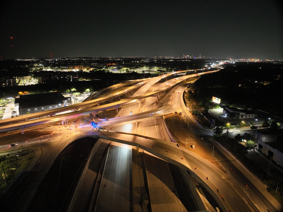Oak Hill Parkway Single-Point Urban Interchange illuminated at night, looking east. July 2026.