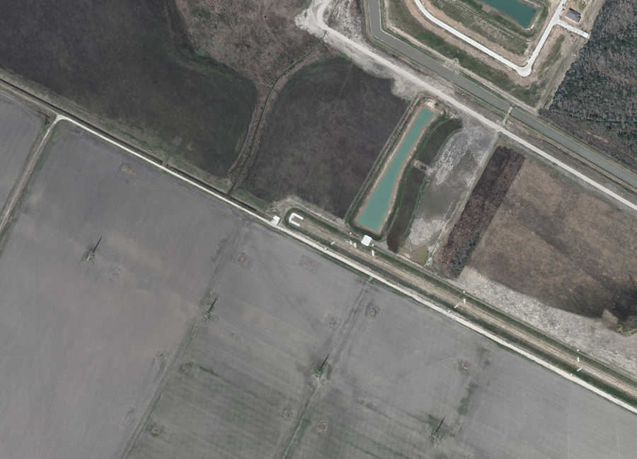 Aerial image of Grand Parkway Segment B-1 area in 2026 prior to construction beginning, showing a pond.