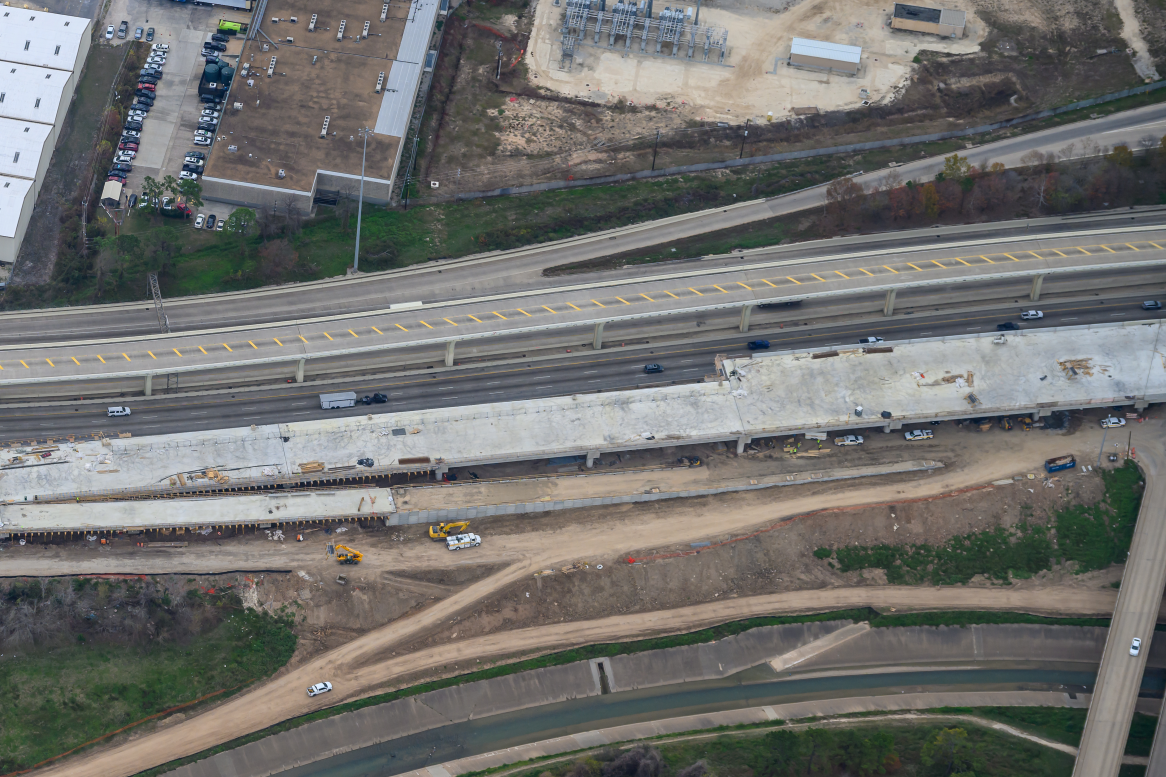 Aerial view of construction at I-10 westbound mainlanes & frontage road pavement and bridges