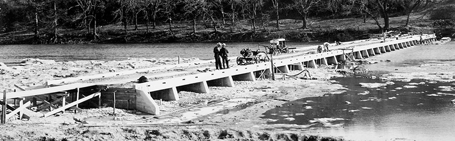 Workers constructing a new bridge over the Colorado River at Lohman’s Crossing in Travis County in the 1930s.
