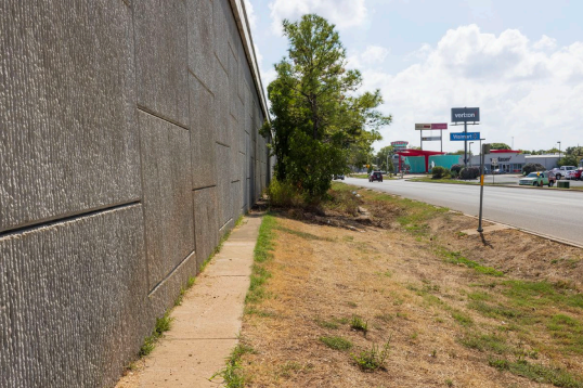 Concrete Mow Strip at Base of Wall