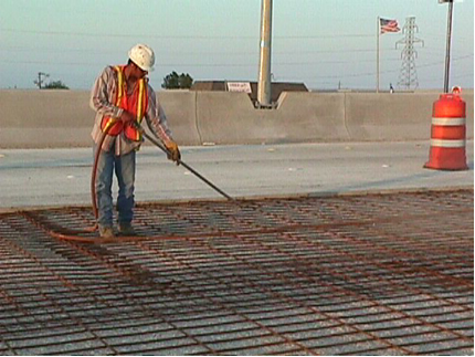 Airblasting to clean the concrete surface. (click in image to see full-size image)