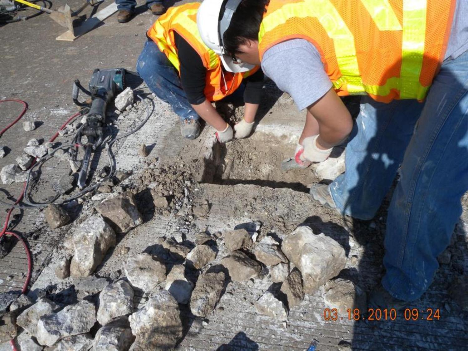 Removing deteriorated concrete. (click in image to see full-size image)