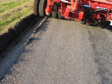 Lateral shear failure at the pavement edge(2nd photo). (click in image to see full-size image)