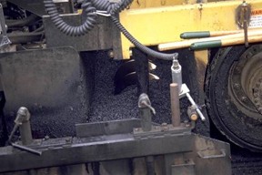 Augers distributing HMA.© Copyright 2006 University of Washington (click in image to see full-size image)