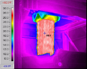 Infrared picture of an HMA storage siloloading a truck showing the hot uniform temperature of the mix.© Copyright 2006 University of Washington (click in image to see full-size image)