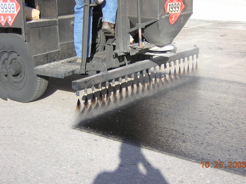 Tack coat application showing nozzle coveragearea.© Copyright 2006 University of Washington (click in image to see full-size image)
