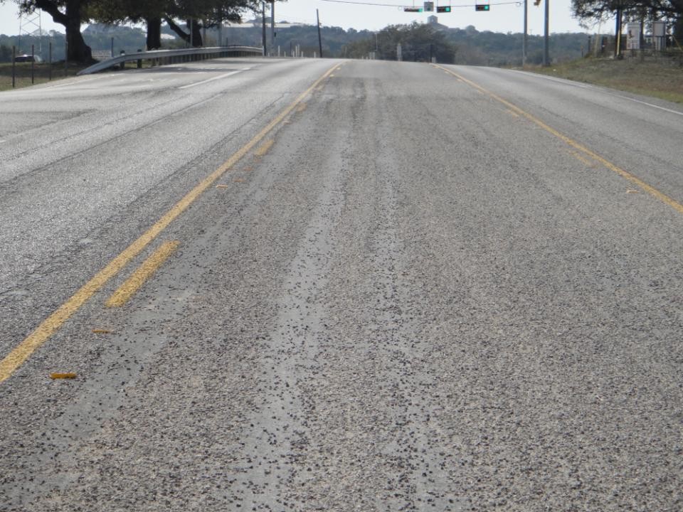 Seal coat pavement surface exhibiting aggregateloss. (click in image to see full-size image)