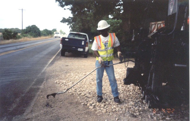 Typical Hand Sprayer on Asphalt Distributor. (click in image to see full-size image)
