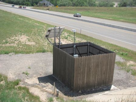 One means of achieving anti-icing is thisautomatic injection system in use in the Amarillo District. Photoshows chemical tank and controls, while the plumbing that gets theliquid to the road is underground. (click in image to see full-size image)