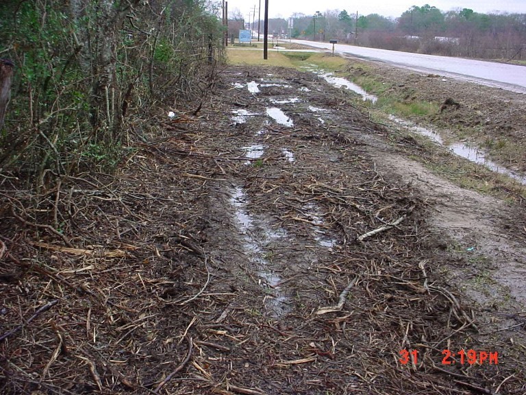 Pruning debris not removed and right of way damage by utility. (click in image to see full-size image)