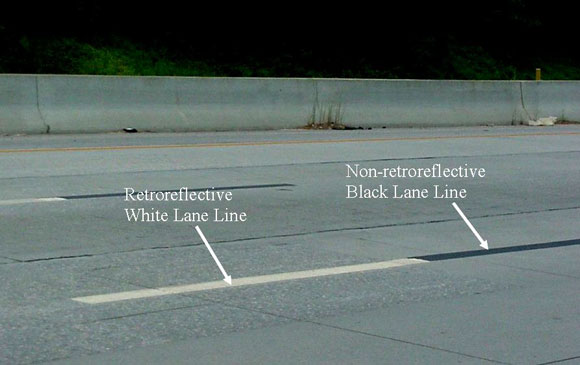 Typical contrast pavement marking for lane (line lead-lag layout). (click in image to see full-size image)