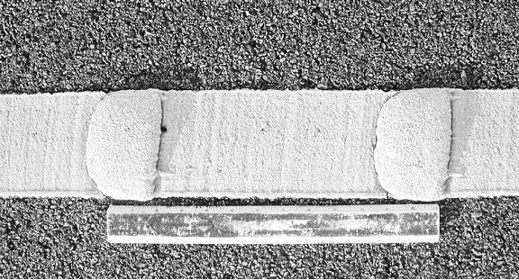 Typical raised-profile thermoplastic marking (overhead view). (click in image to see full-size image)