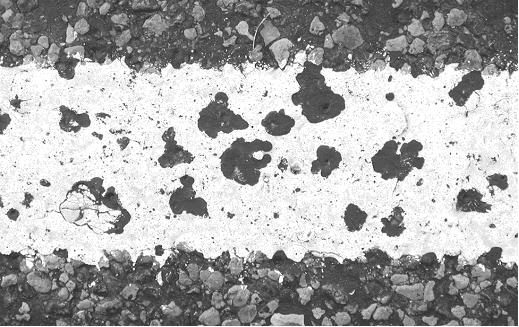 Asphalt boiling through hot thermoplastic. (click in image to see full-size image)