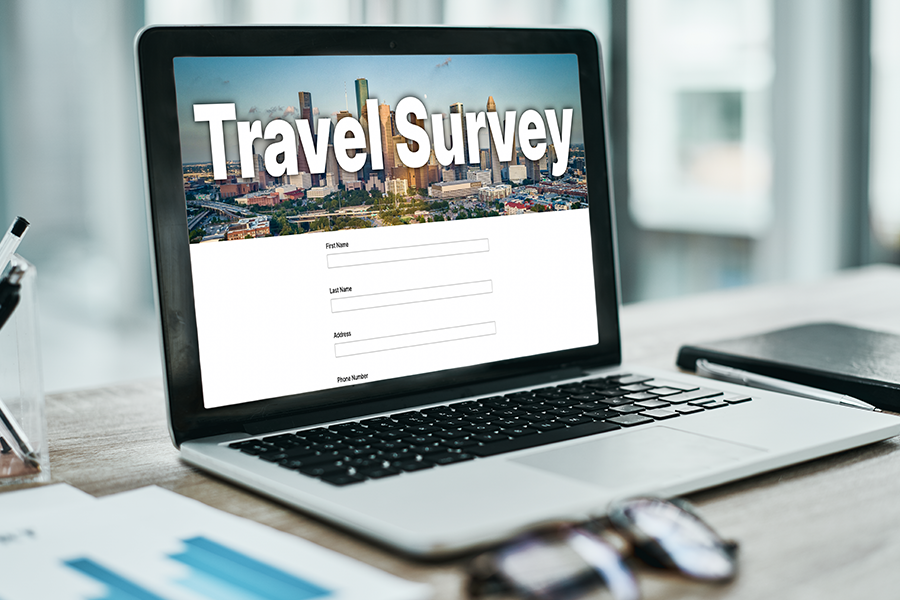 Laptop viewing travel survey webpage