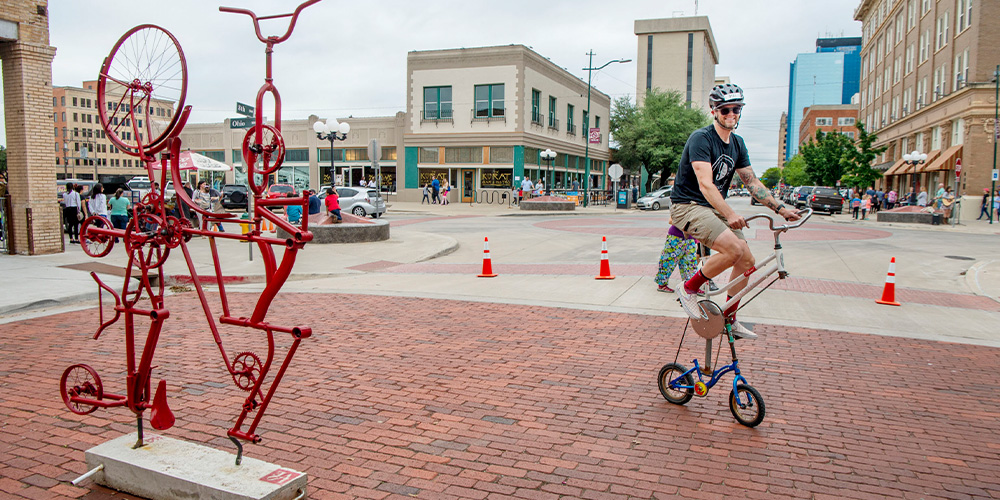 Cyclist on custom bicycle